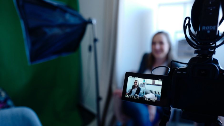 A woman is being recorded for a user interview