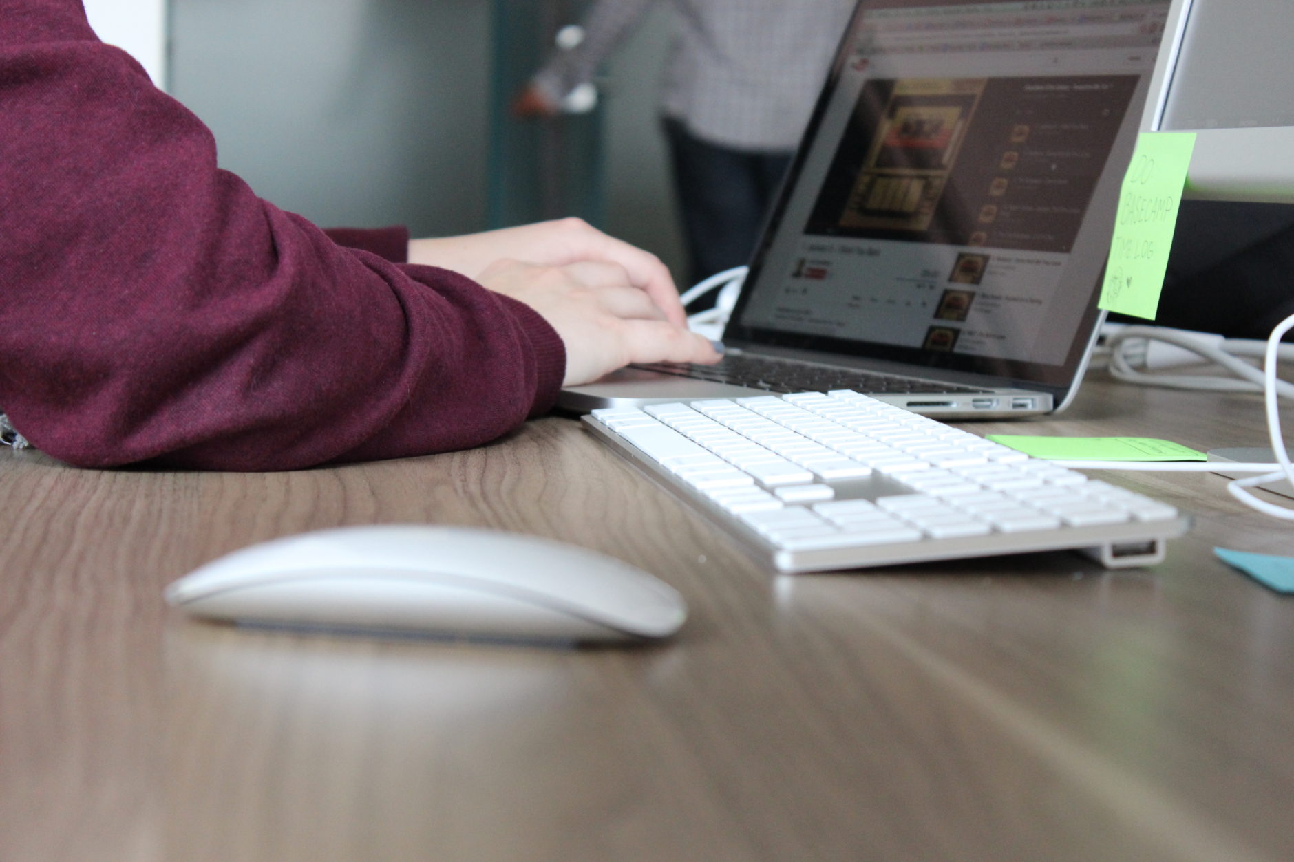 Person at a computer conducting in-context enterprise software UX design research.